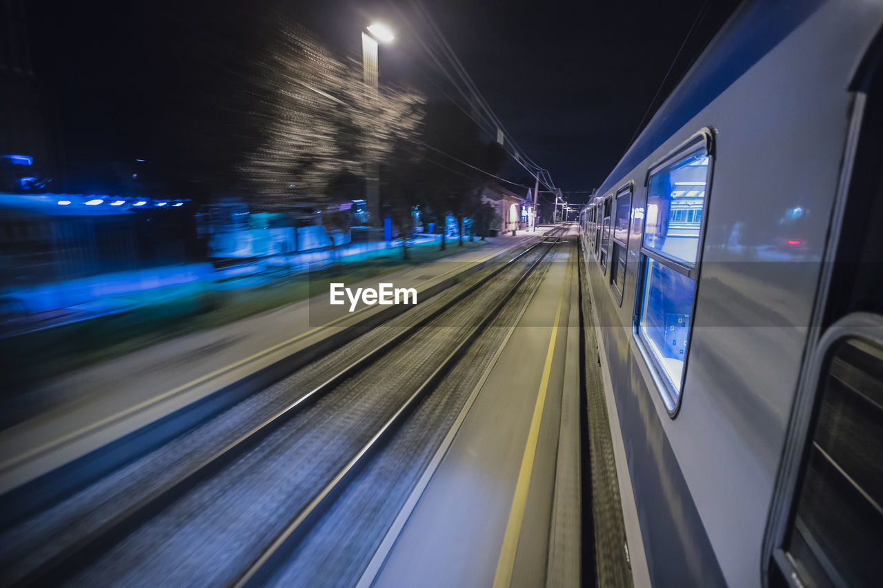 BLURRED MOTION OF TRAIN AT NIGHT