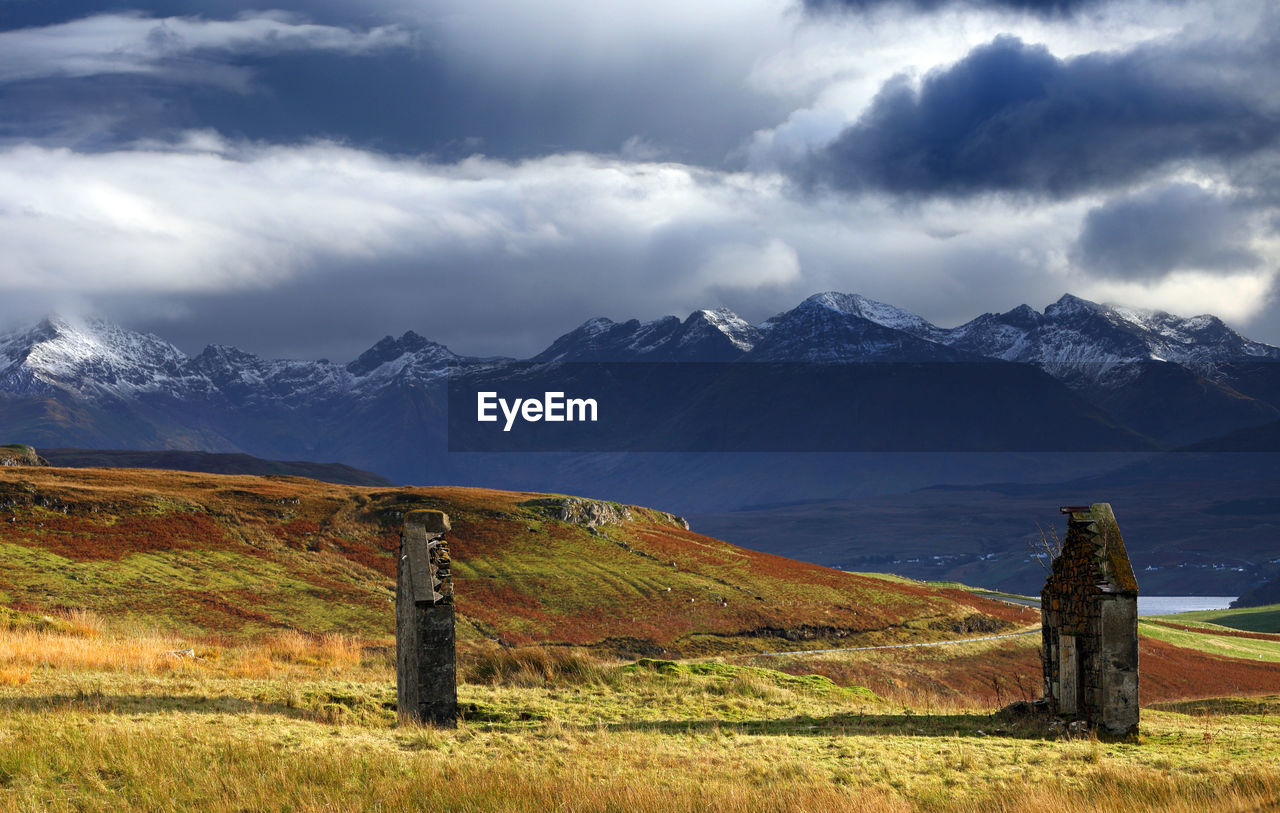 Scenic view of mountain against cloudy sky