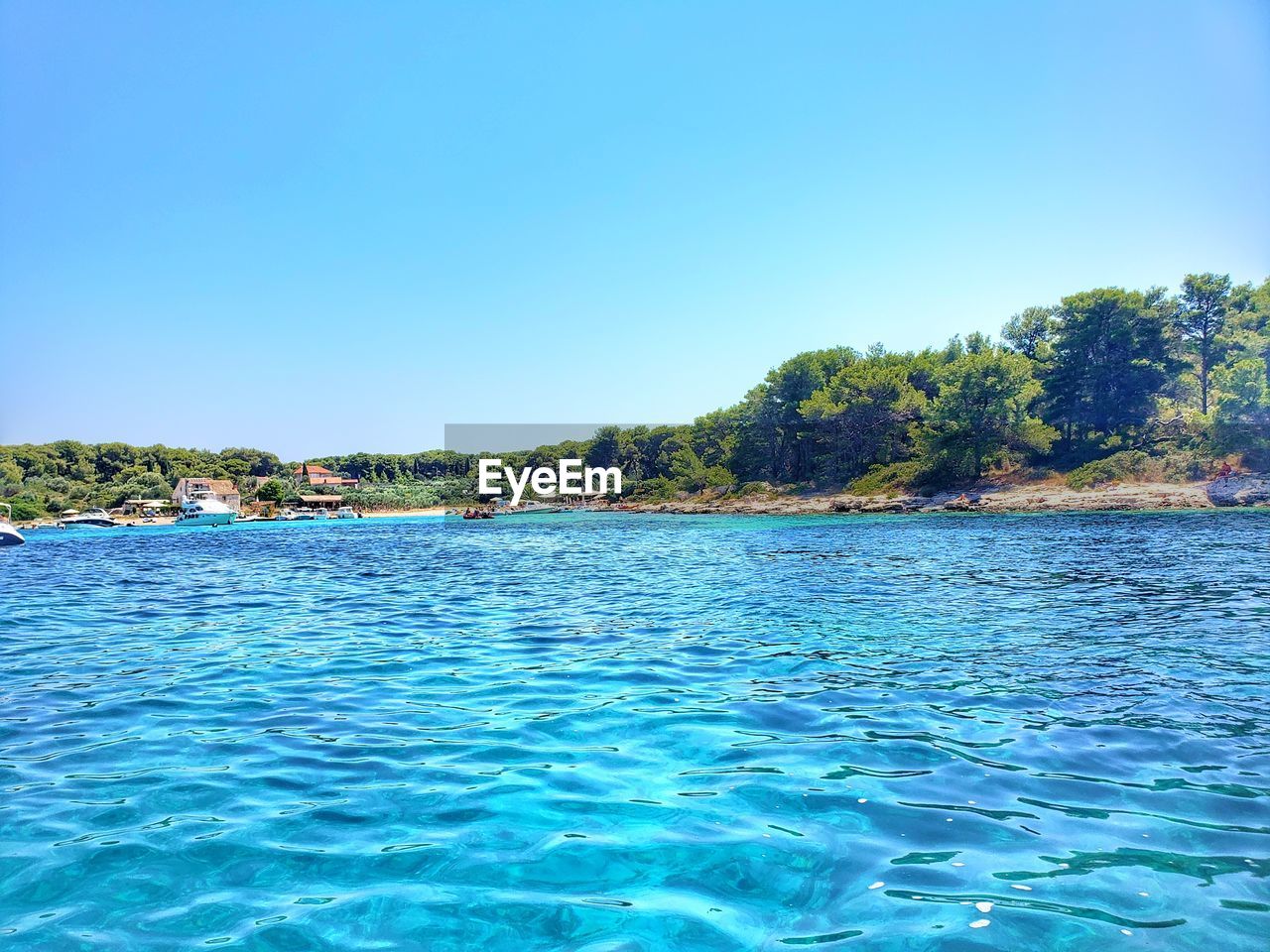 SCENIC VIEW OF BLUE SEA AGAINST CLEAR SKY