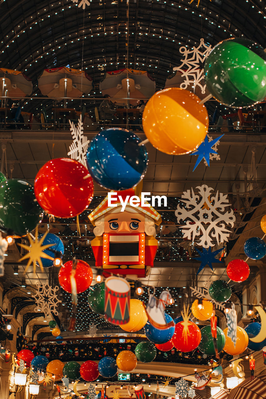 Nutcracker, winter snowflakes, garlands hanging in the historic russian shopping mall gum. christmas