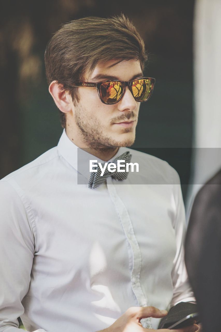 Close-up of young man wearing sunglasses