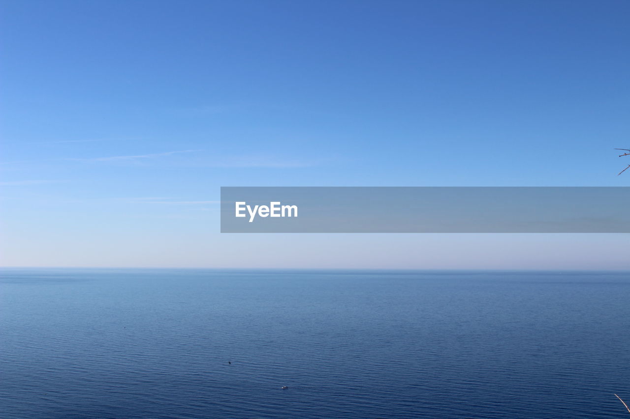 SCENIC VIEW OF SEA AGAINST BLUE SKY