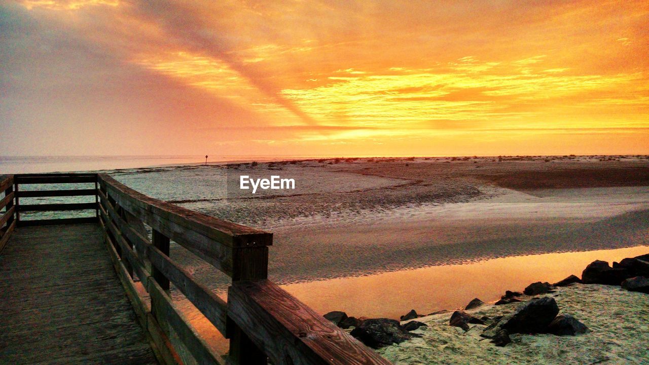 Scenic view of sea at sunset