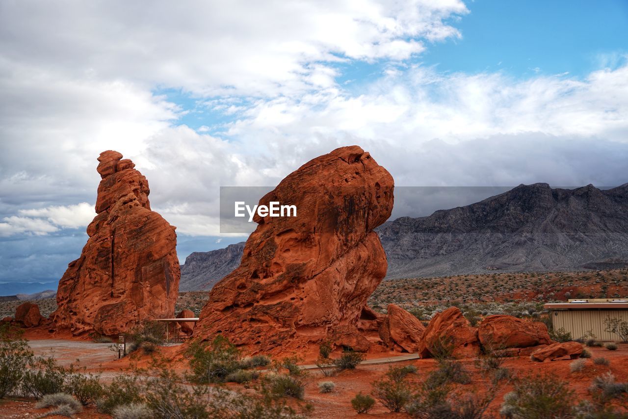 Rock formations on landscape against sky