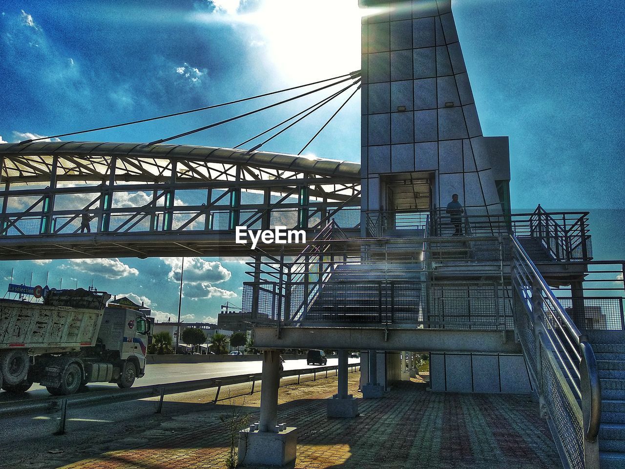 LOW ANGLE VIEW OF RAILROAD BRIDGE AGAINST SKY