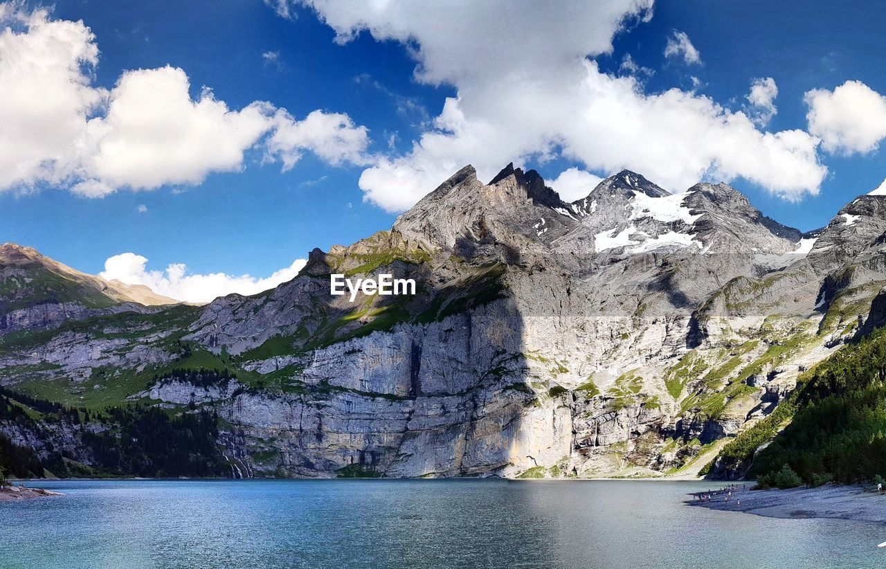 Scenic view of mountains and sea against sky