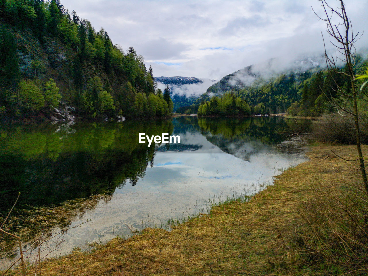 Scenic view of a lake in the bavarian alps  on a rainy day near seegatterl 