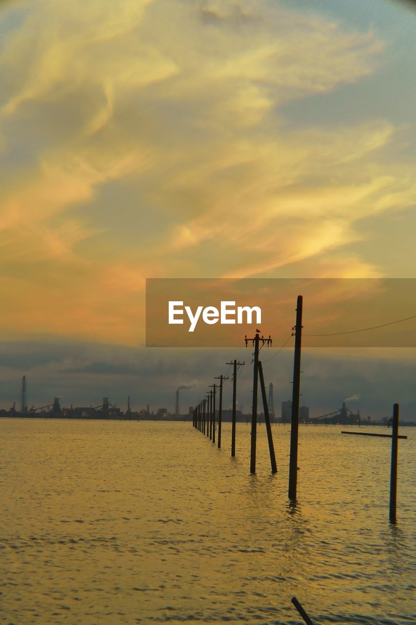 Scenic view of sea against sky at sunset