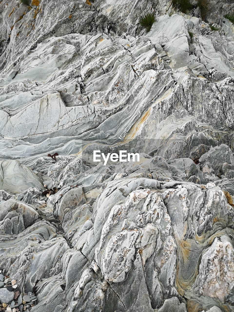 HIGH ANGLE VIEW OF ROCK FORMATIONS ON LAND