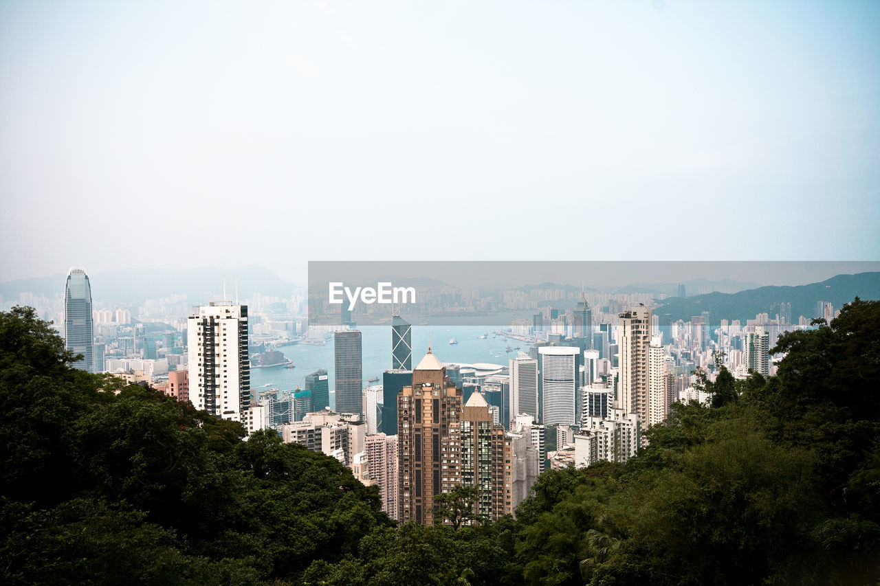 Skyscrapers in city against clear sky