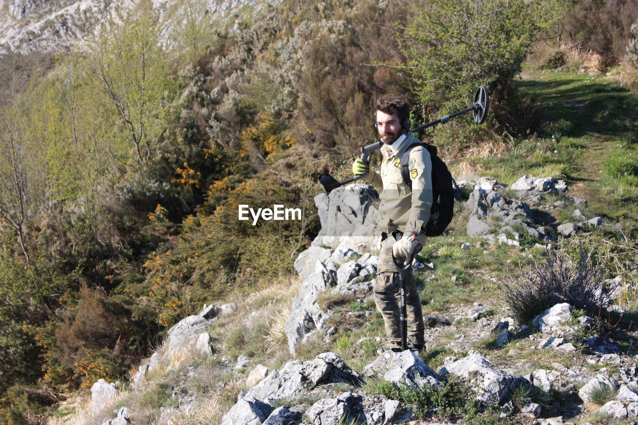 PORTRAIT OF MAN IN FOREST