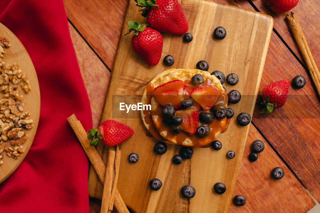 High angle view of strawberries on table