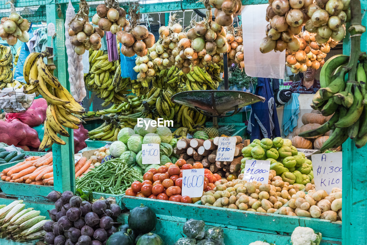 VARIOUS FRUITS FOR SALE IN MARKET STALL