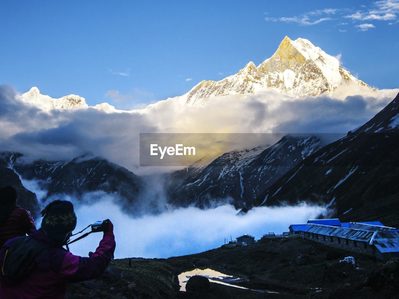 Scenic view of snow covered mountains