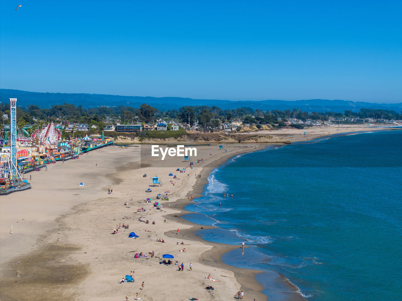 panoramic view of beach against clear blue sky