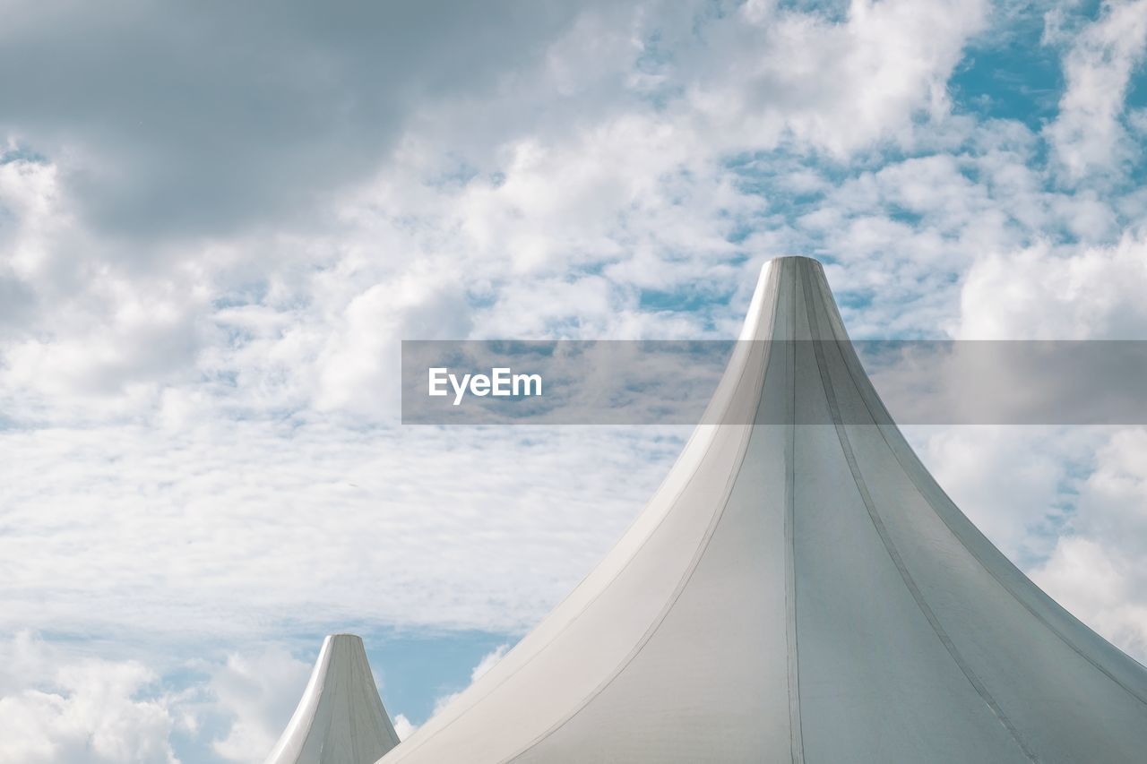 Tent against cloudy sky