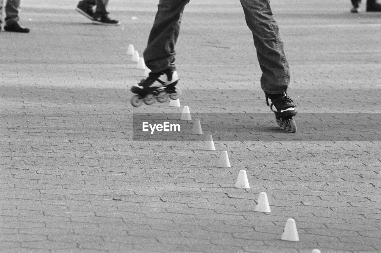 LOW SECTION OF MEN WALKING ON STREET