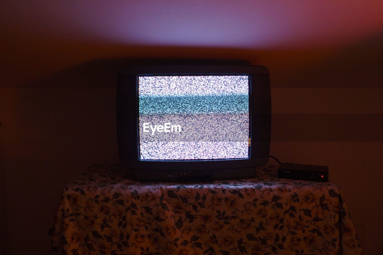 Close-up of tv at home