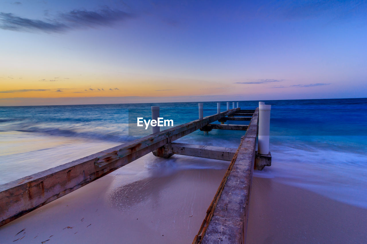 Scenic view of sea against sky at sunset