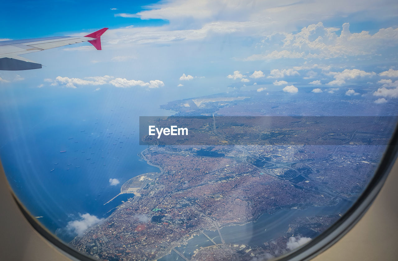 Aerial view of sky seen through airplane window