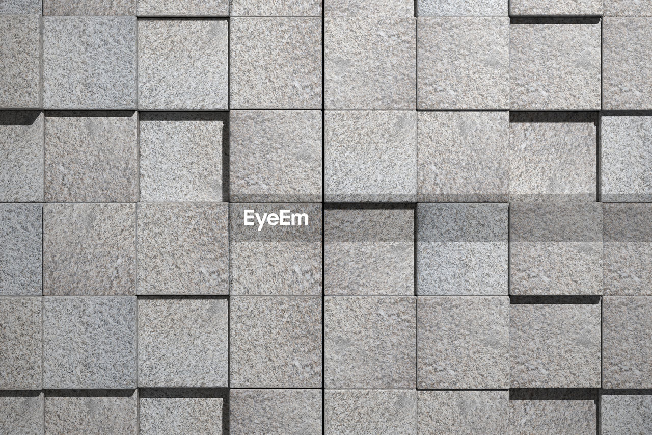 3d rendering of a stone cubes wall