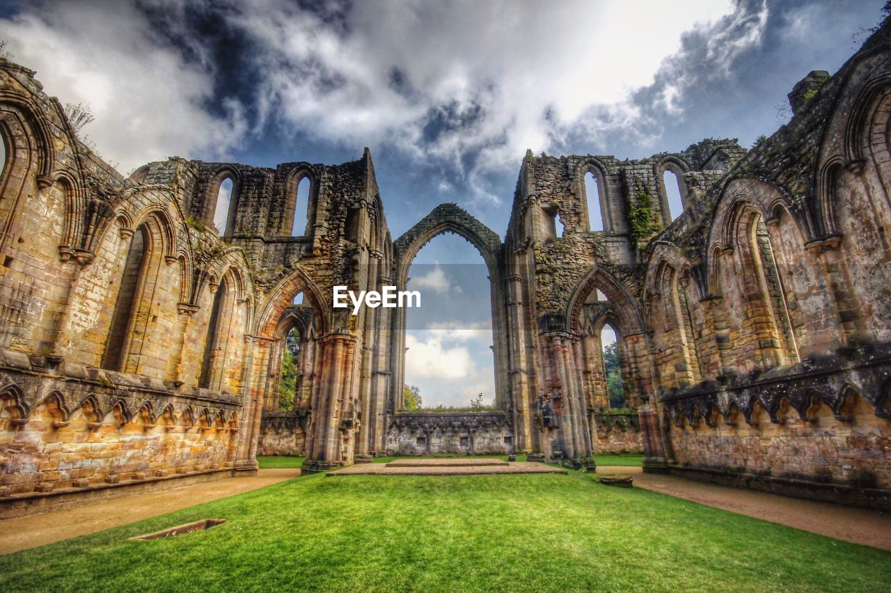 OLD RUINS AGAINST CLOUDY SKY