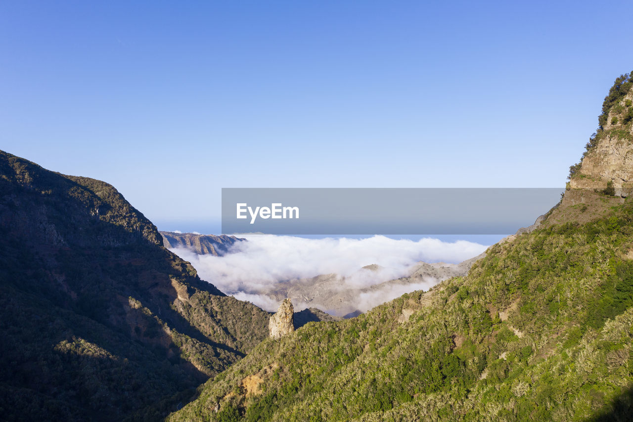 Drone view of clear sky over espigon de ibosa rock formation in garajonay national park