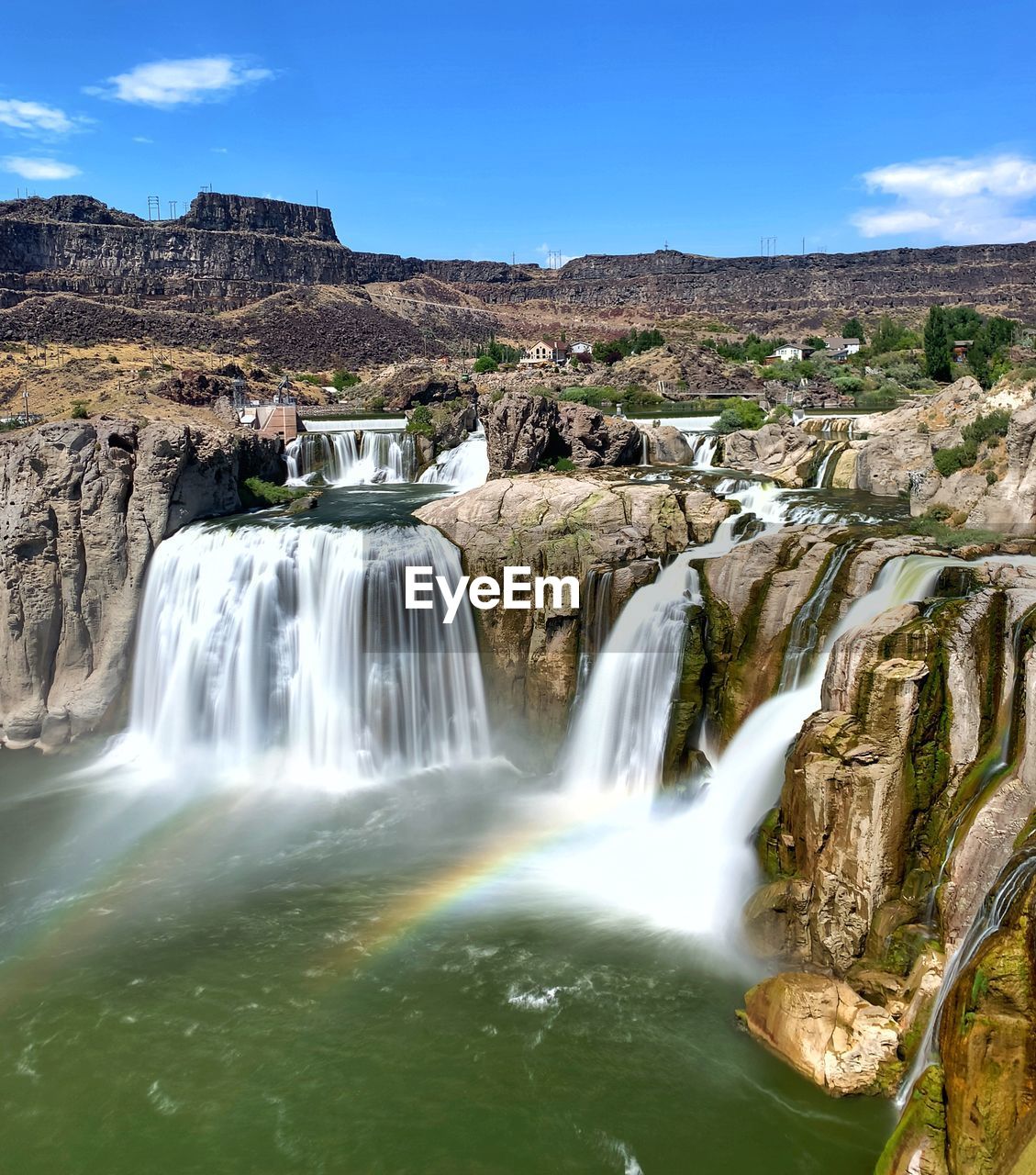 VIEW OF WATERFALL AGAINST SKY