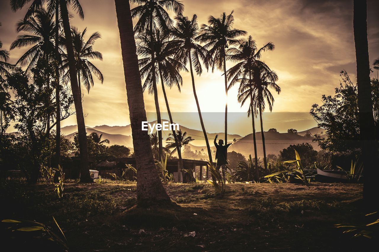 Tourist in village at sunset