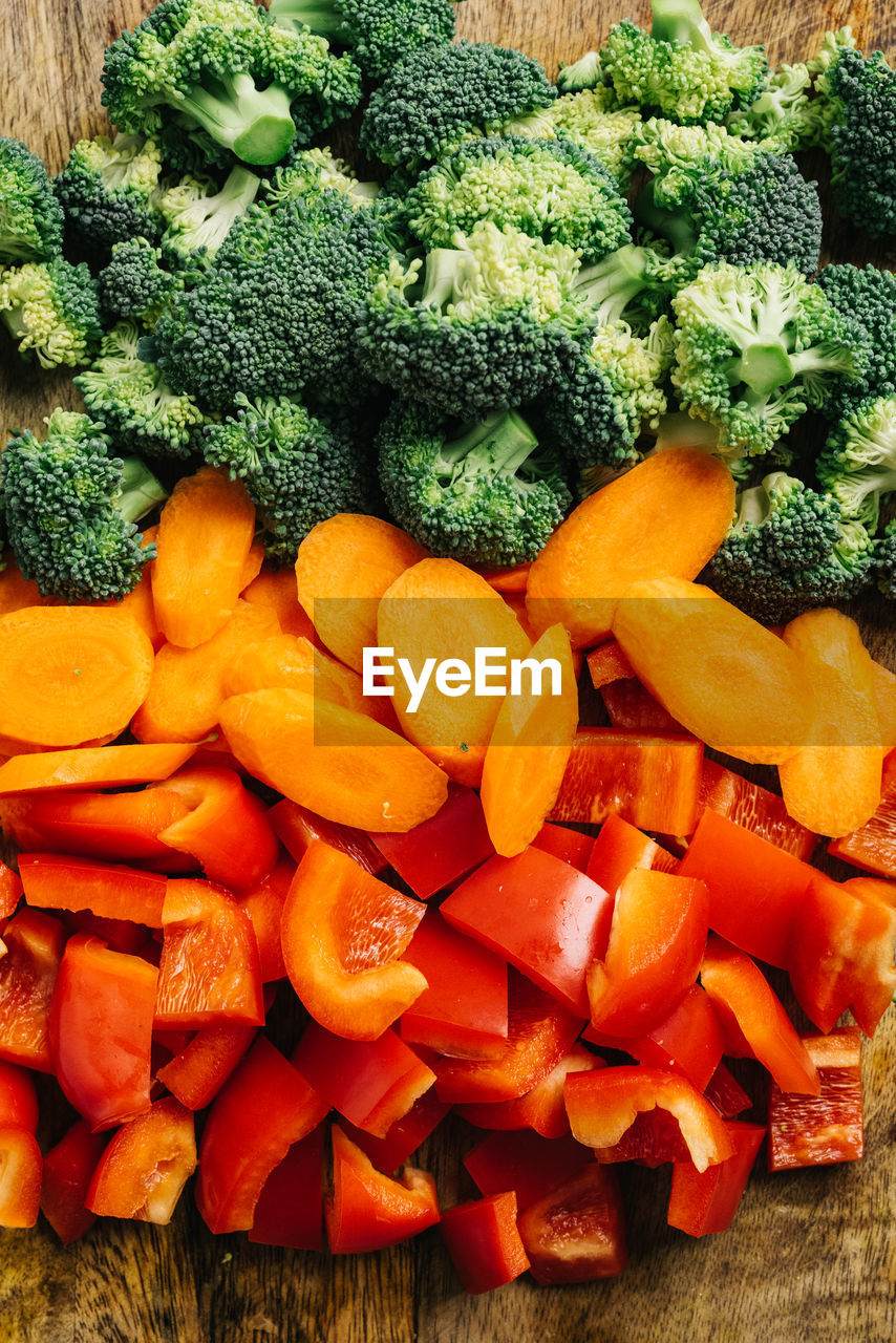 Mixed vegetables sliced on a cutting board still life