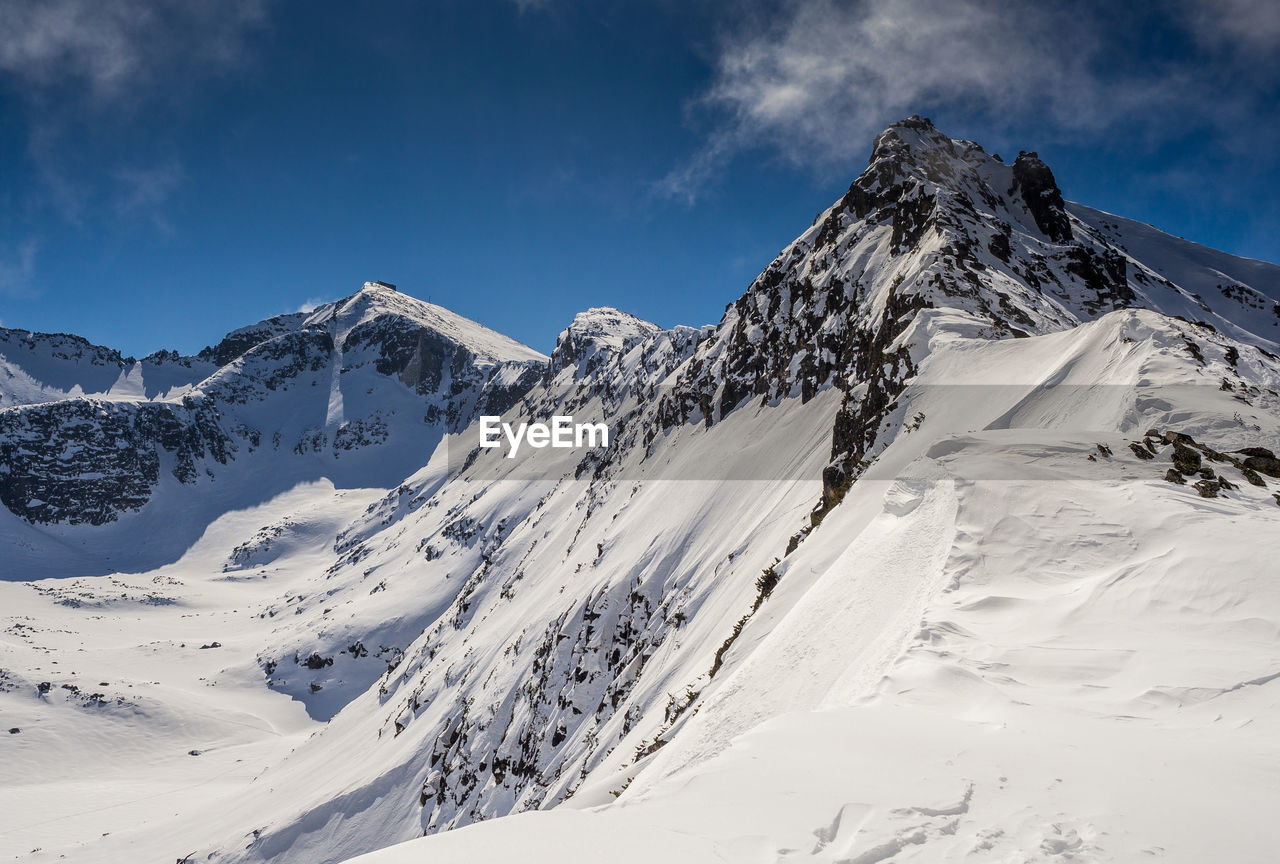 Scenic view of snowcapped mountains. 