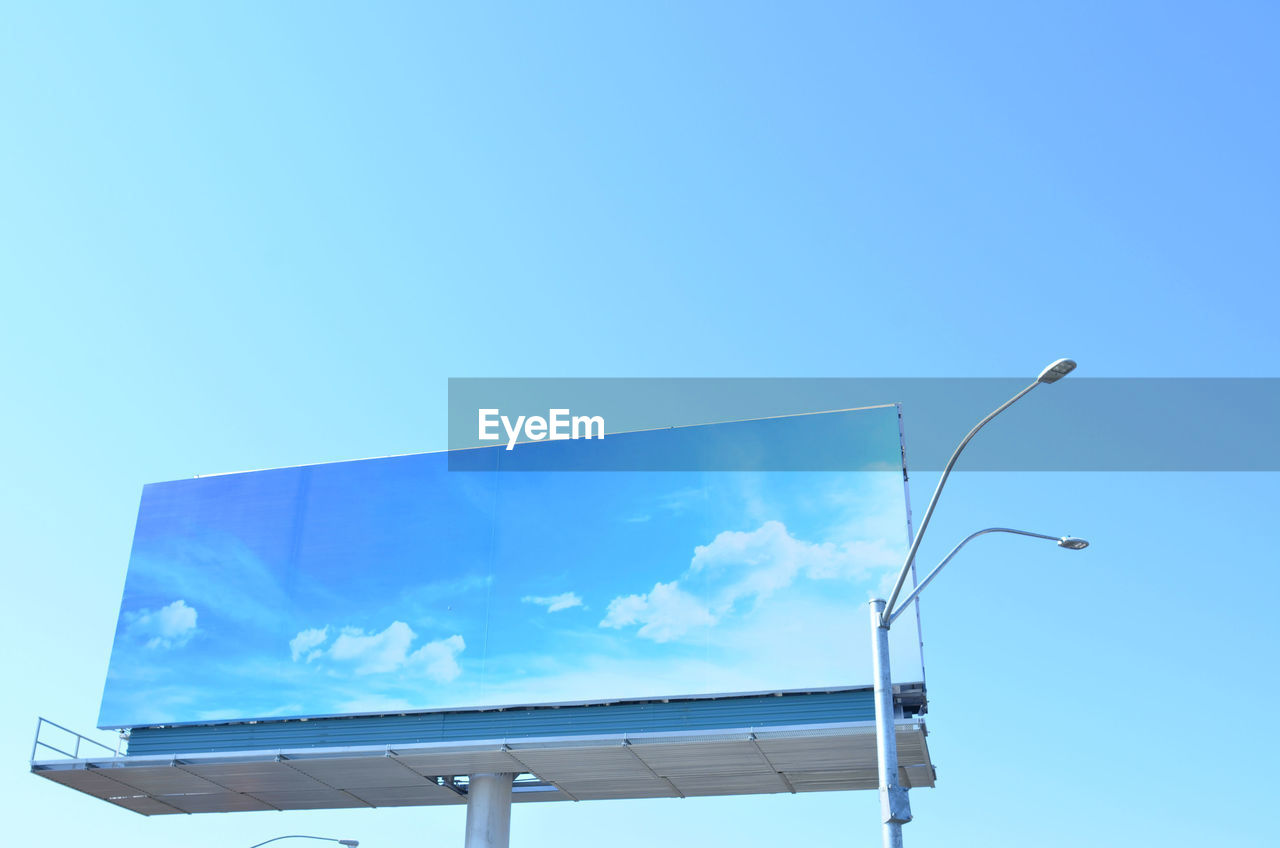 Close-up of blue sky billboard