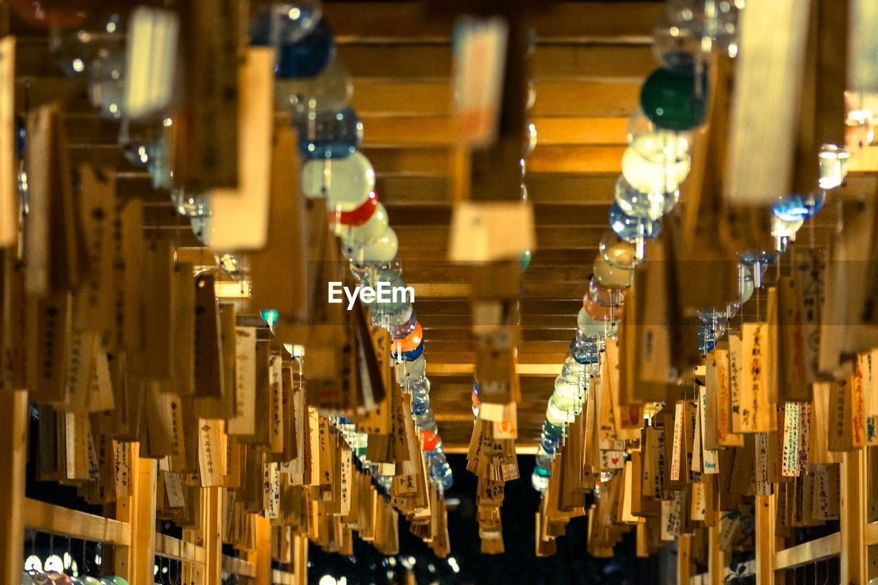 Row of prayer texts souvenirs at retail store