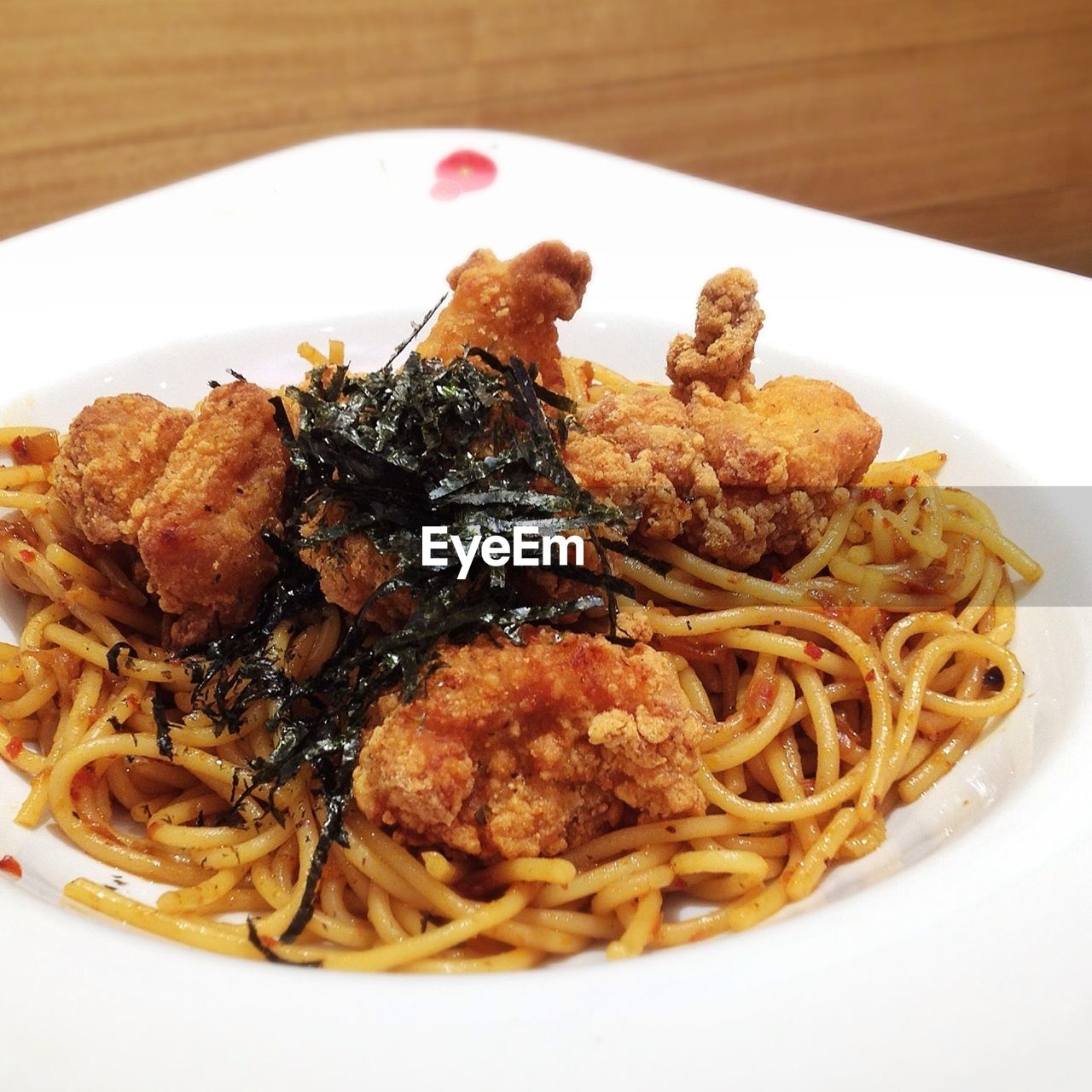 Close-up of noodles with roasted chicken