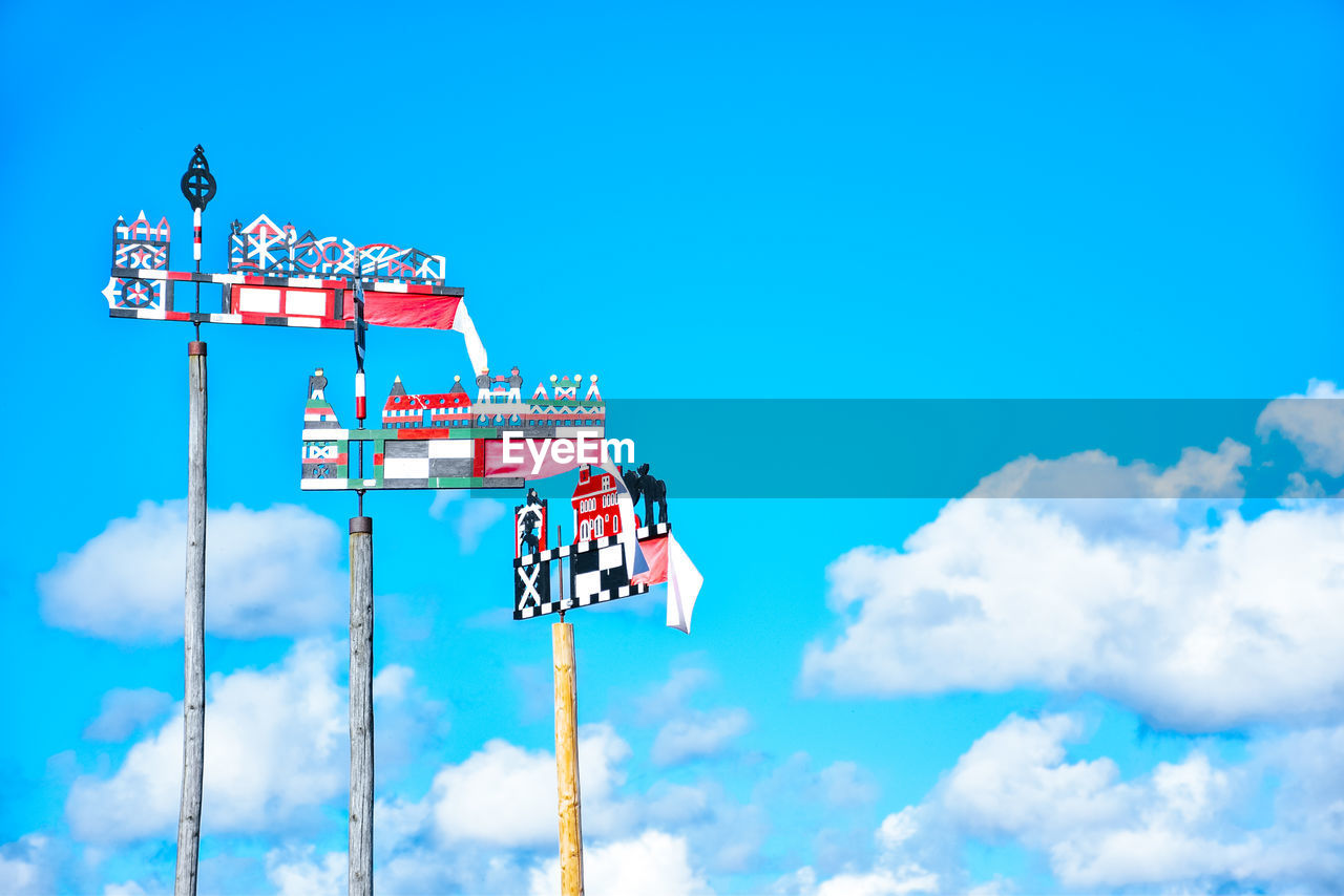 LOW ANGLE VIEW OF INFORMATION SIGN AGAINST SKY