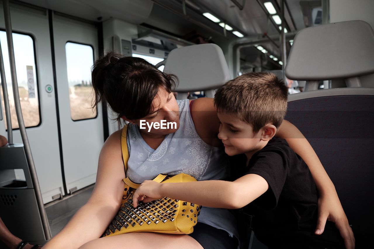 Mother and son in train