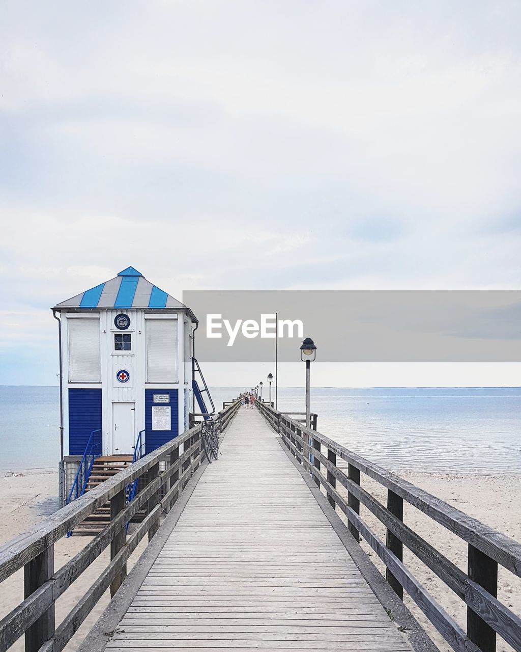 Pier over sea against sky