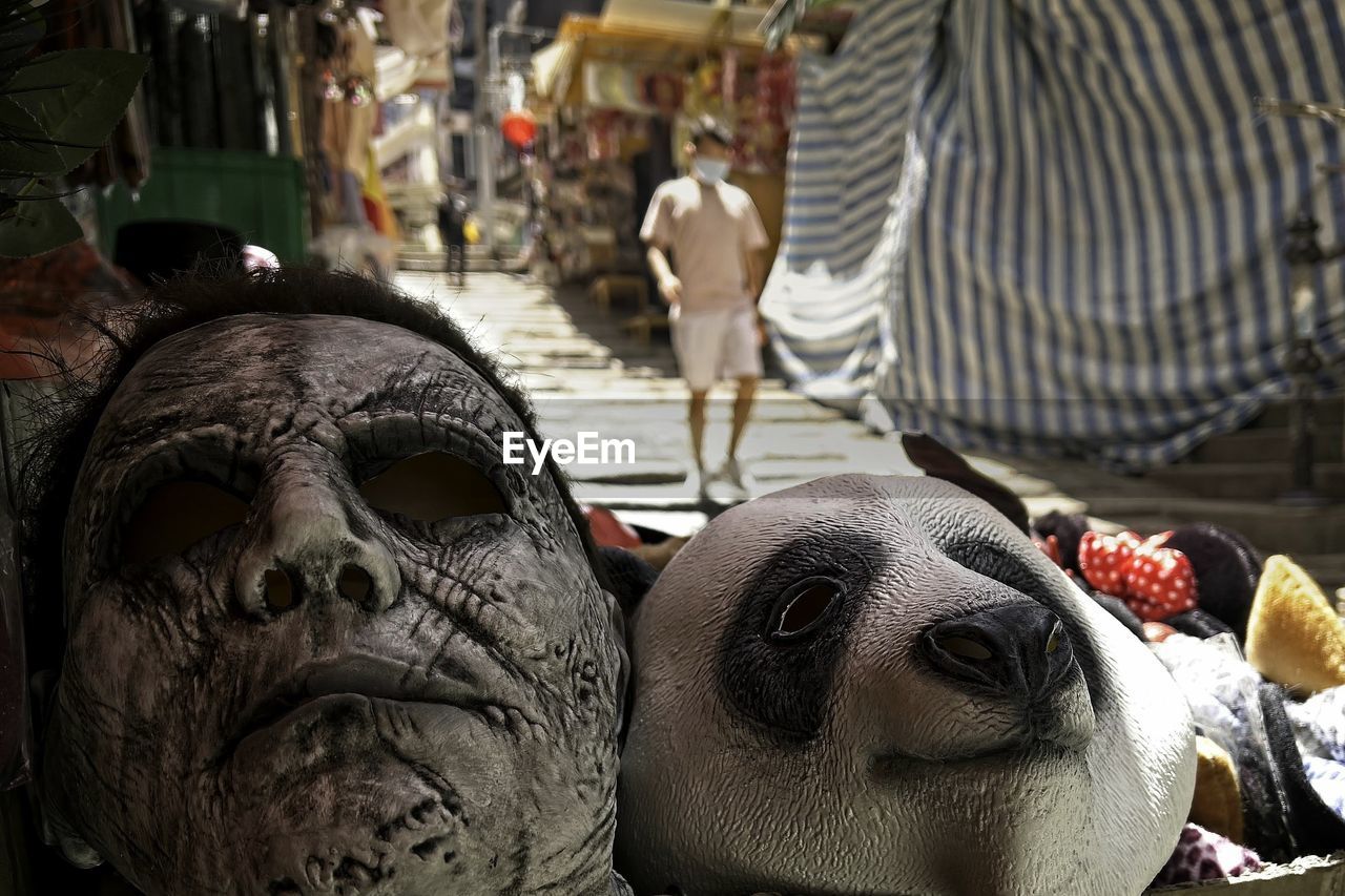 market, representation, craft, animal, animal themes, no people, sculpture, clothing, temple, art, tradition, human representation, day, mammal, retail, creativity, focus on foreground, for sale, architecture