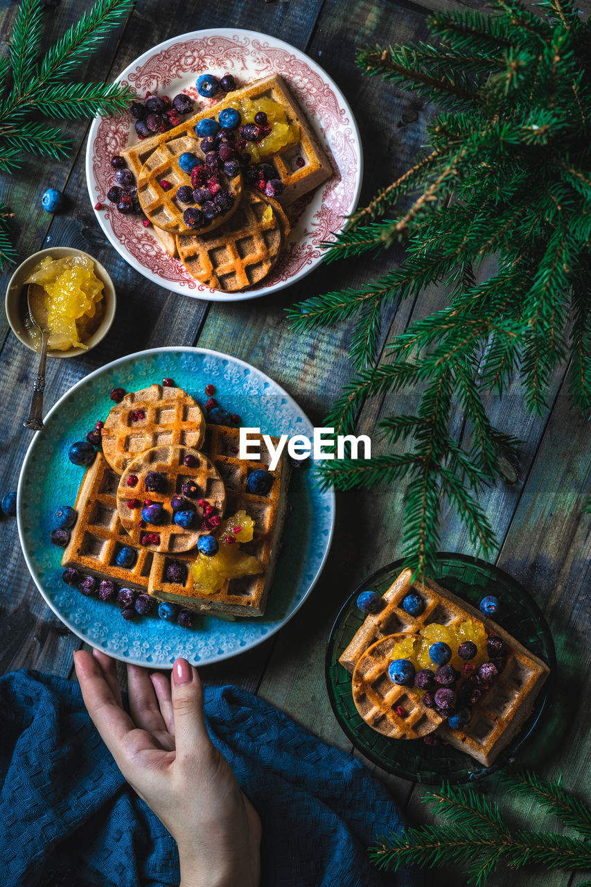 cropped hand of woman holding food