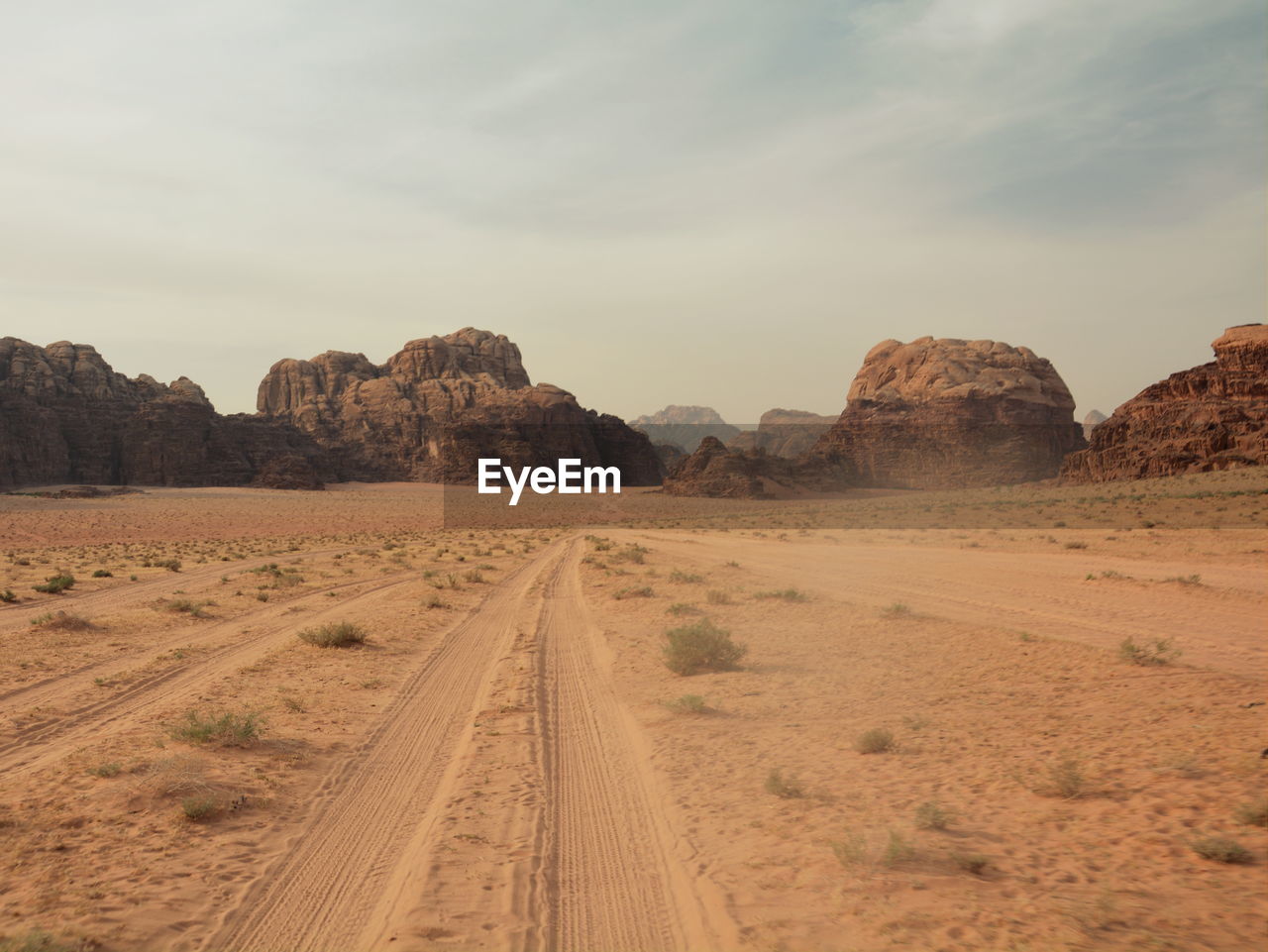 Scenic view of wadi rum desert road against sky in jordan