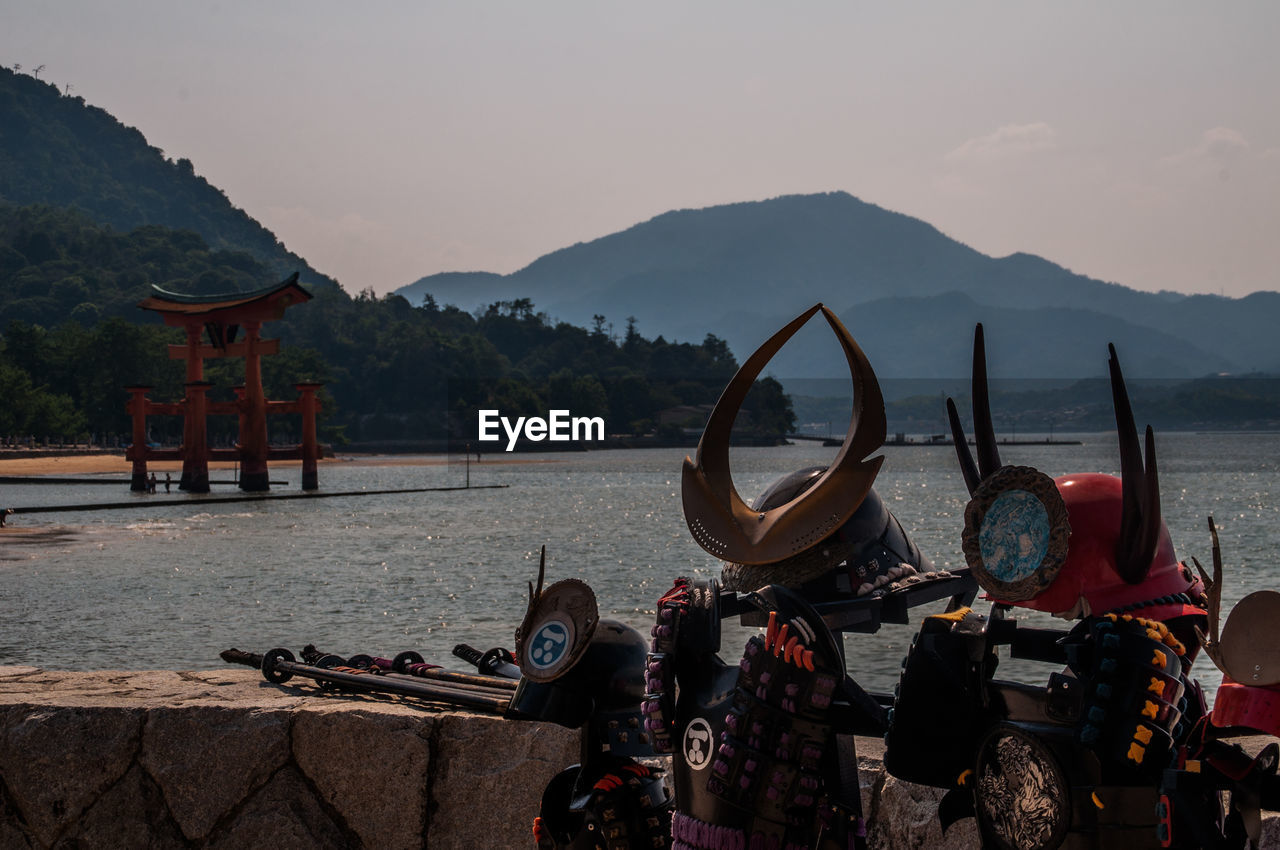 Equipment at beach against mountains