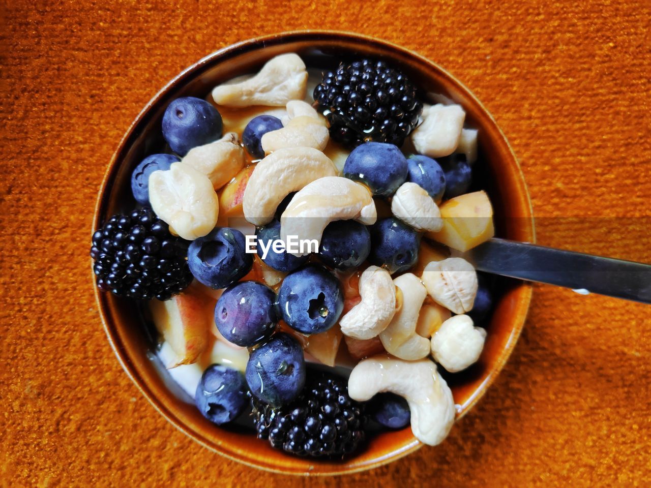 Directly above shot of fruits and nuts in bowl