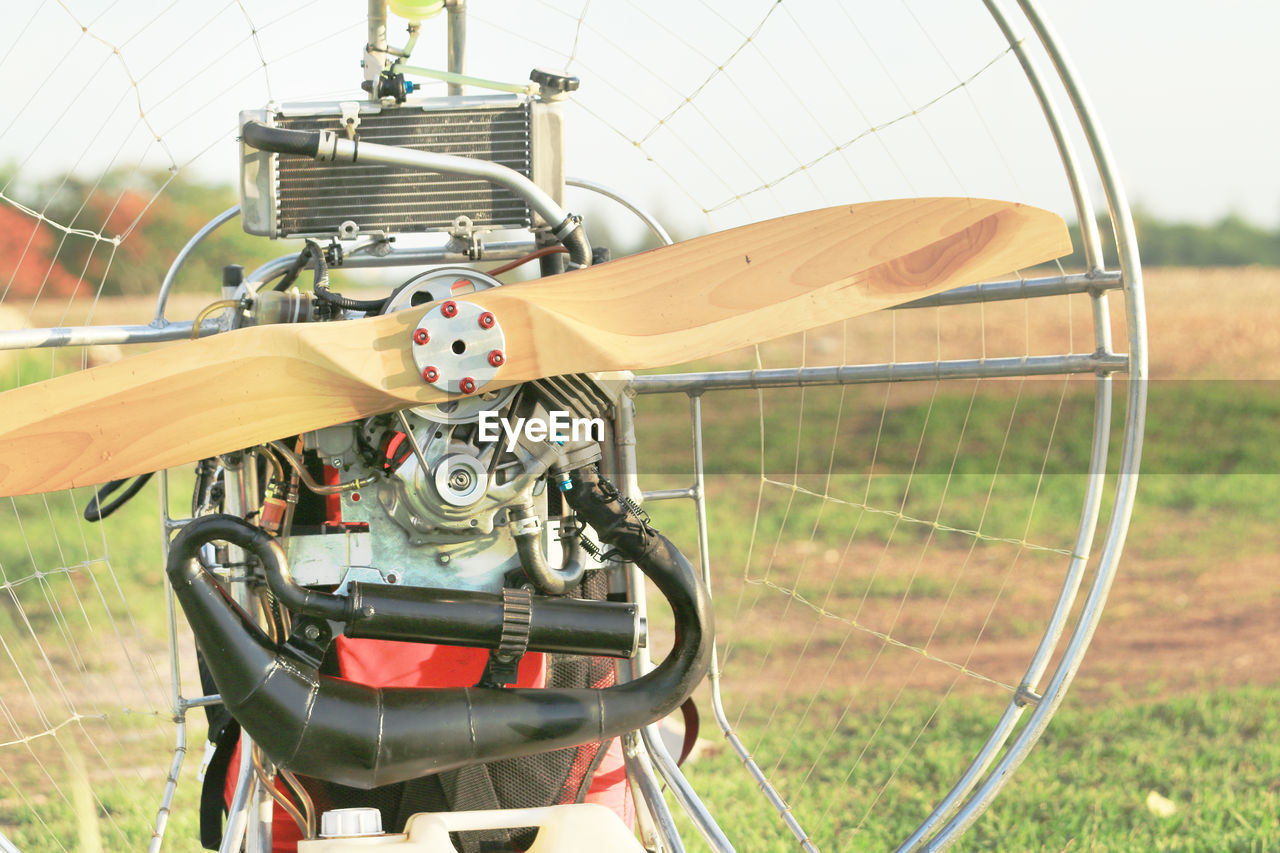 CLOSE-UP OF BICYCLES ON FIELD