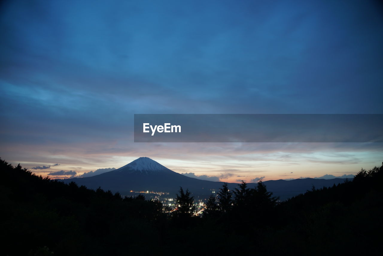 Scenic view of silhouette mountains against sky during sunset