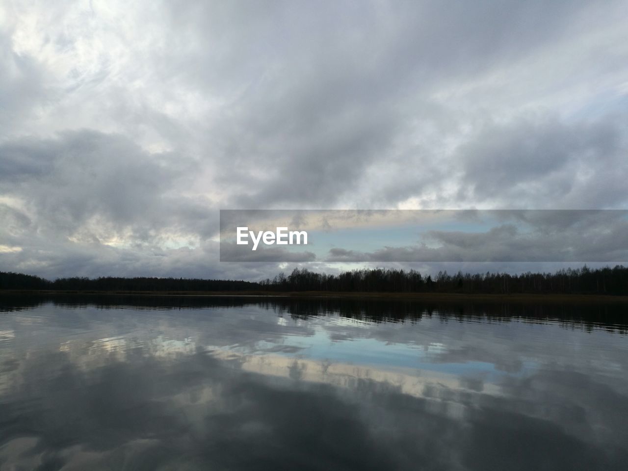 REFLECTION OF SKY ON LAKE