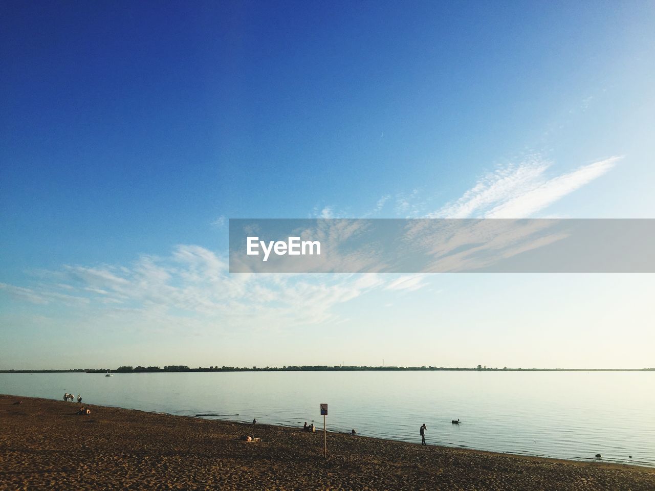 Scenic view of sea against blue sky