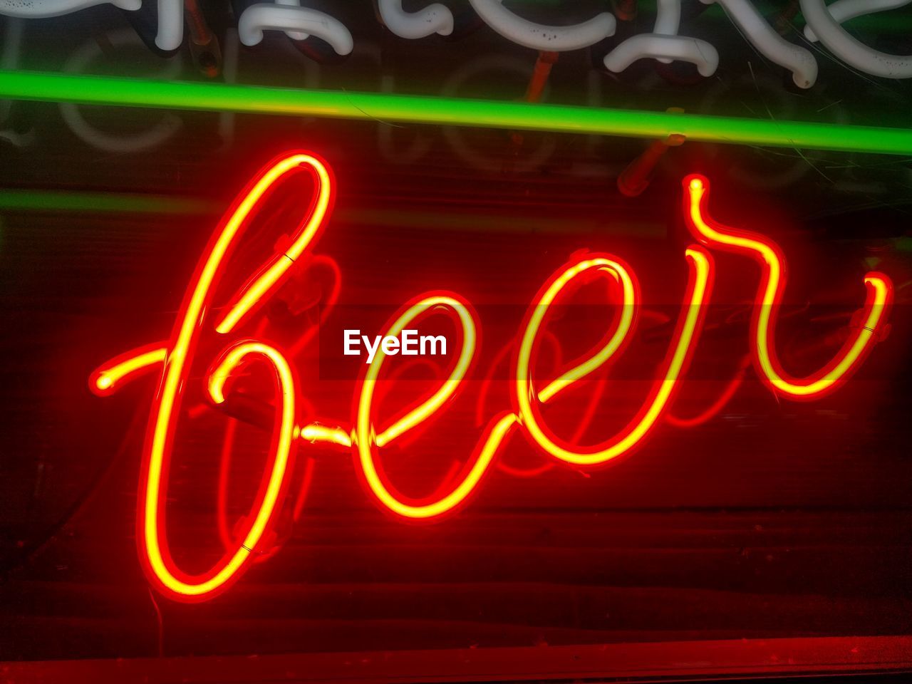 Close-up of illuminated beer text at night