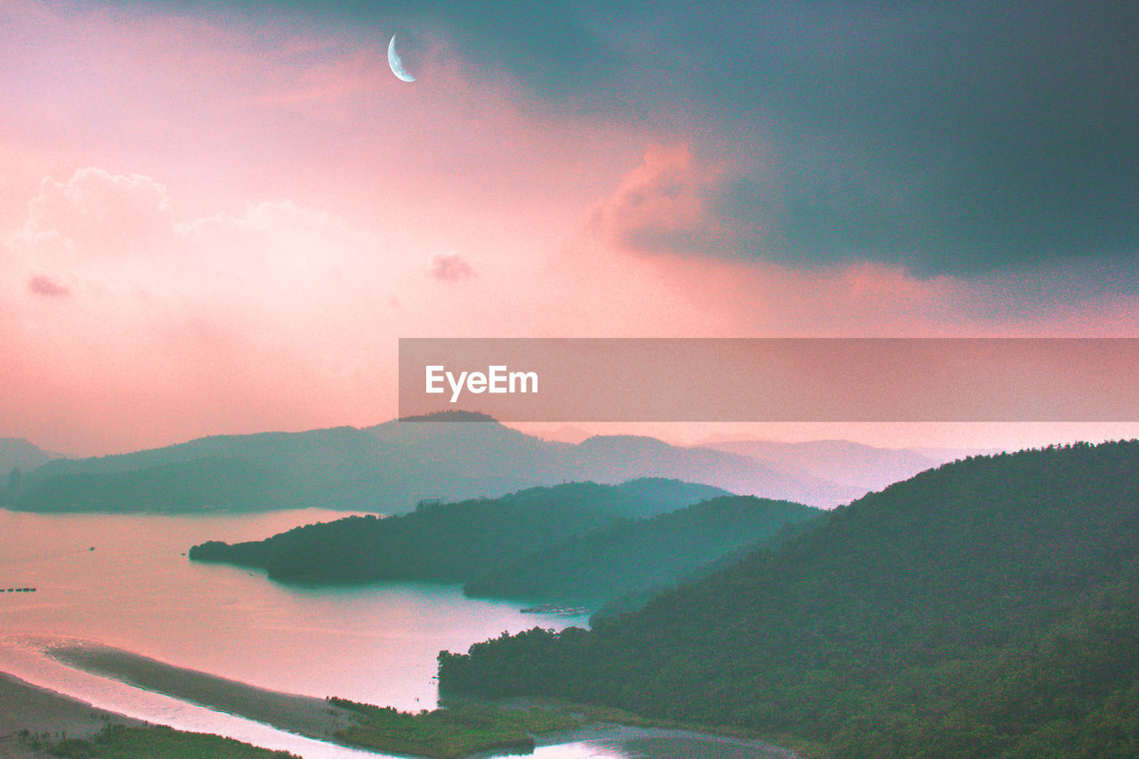 Scenic view of mountains against sky during sunset