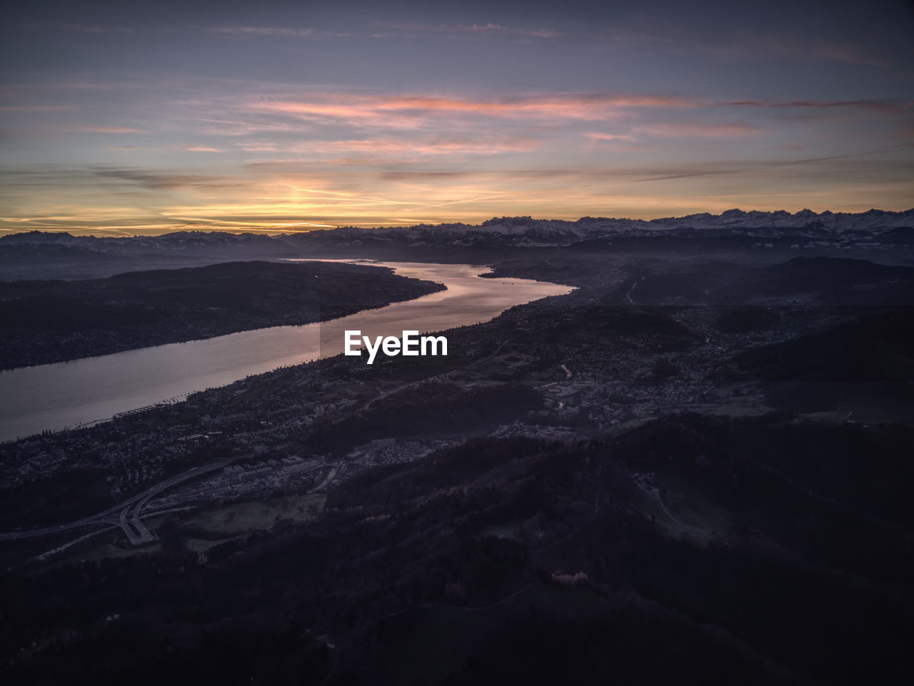 AERIAL VIEW OF LANDSCAPE AGAINST SKY DURING SUNSET