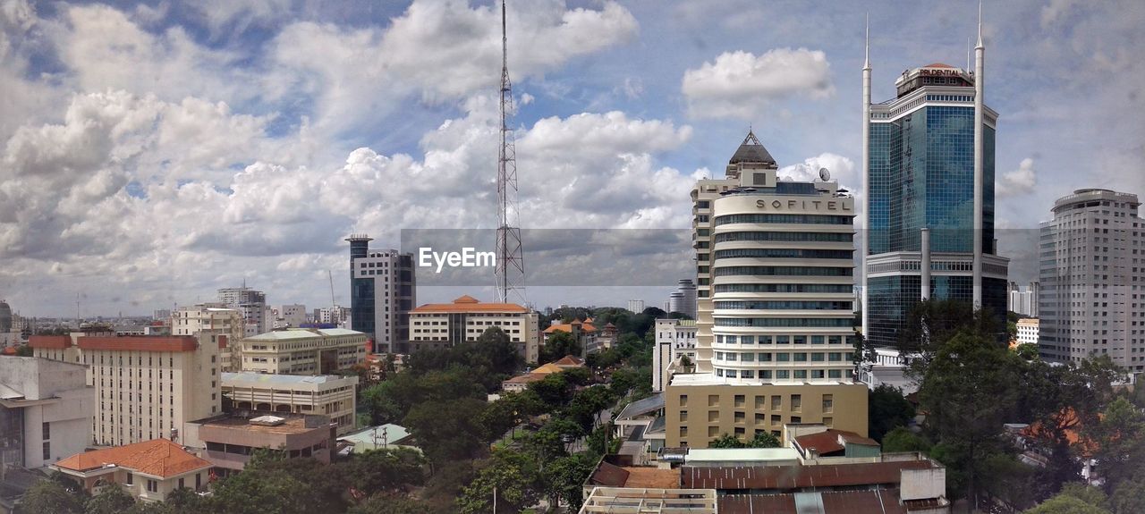 City skyline against cloudy sky